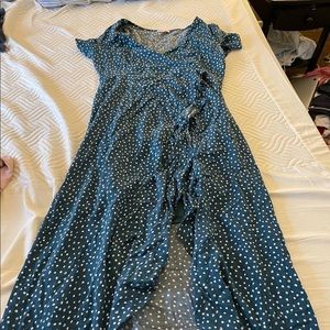 Ruffled hem, open slit polka dot dress.